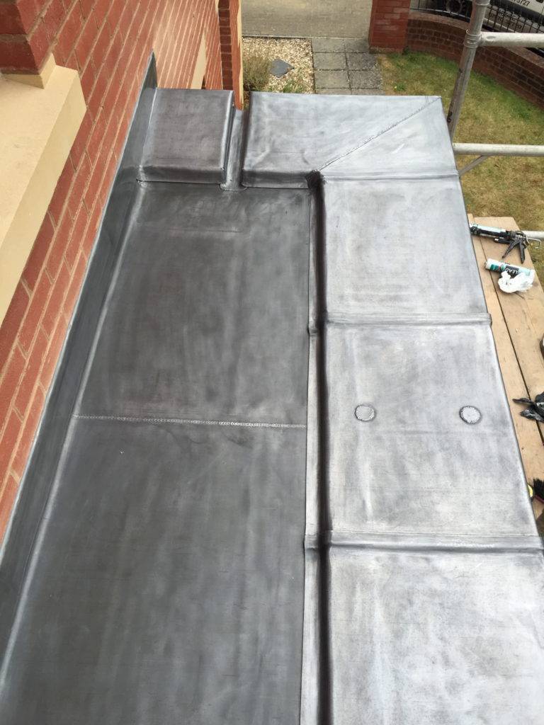 Flat roofing leadwork